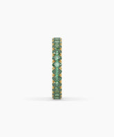 Helene round green gemstone eternity ring in 585 yellow gold, side profile view 