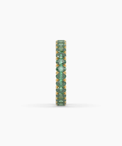 Helene round green gemstone eternity ring in 585 yellow gold, side profile view 