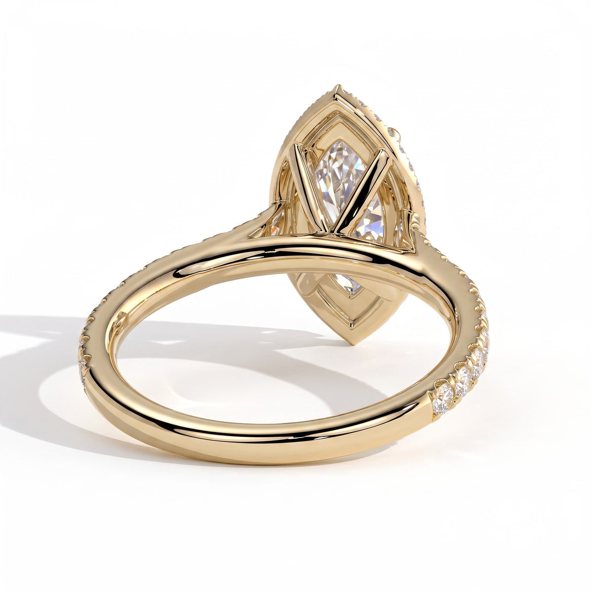 Marquise lab-grown diamond halo engagement ring in 18K (750) yellow gold, on white background 