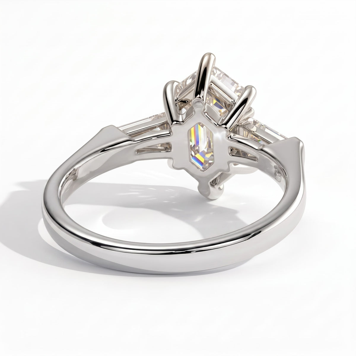 Elongated Hexagon lab-grown diamond three-stone engagement ring in 950 platinum, on white background 