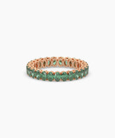 Helene round green gemstone eternity ring in 750 rose gold, front view 