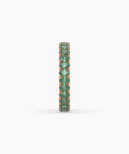 Helene round green gemstone eternity ring in 750 rose gold, side profile view 