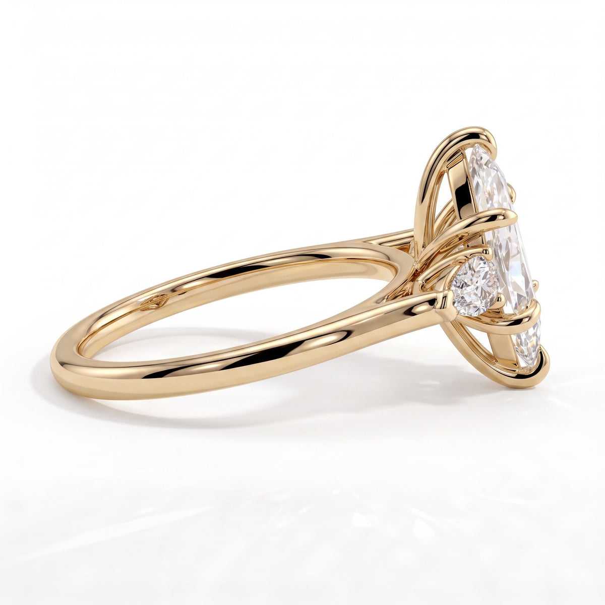 Marquise lab-grown diamond three-stone engagement ring in 18K (750) yellow gold, detail view 