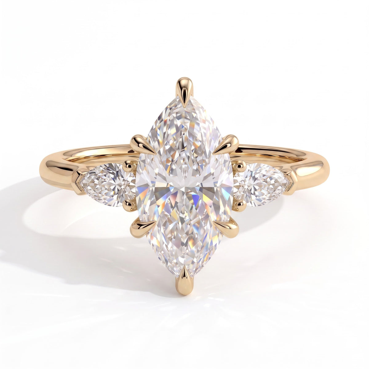 Marquise lab-grown diamond three-stone engagement ring in 18K (750) yellow gold, front view 