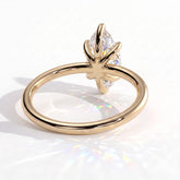 Marquise lab-grown diamond solitaire engagement ring in 14K (585) yellow gold, on white background 