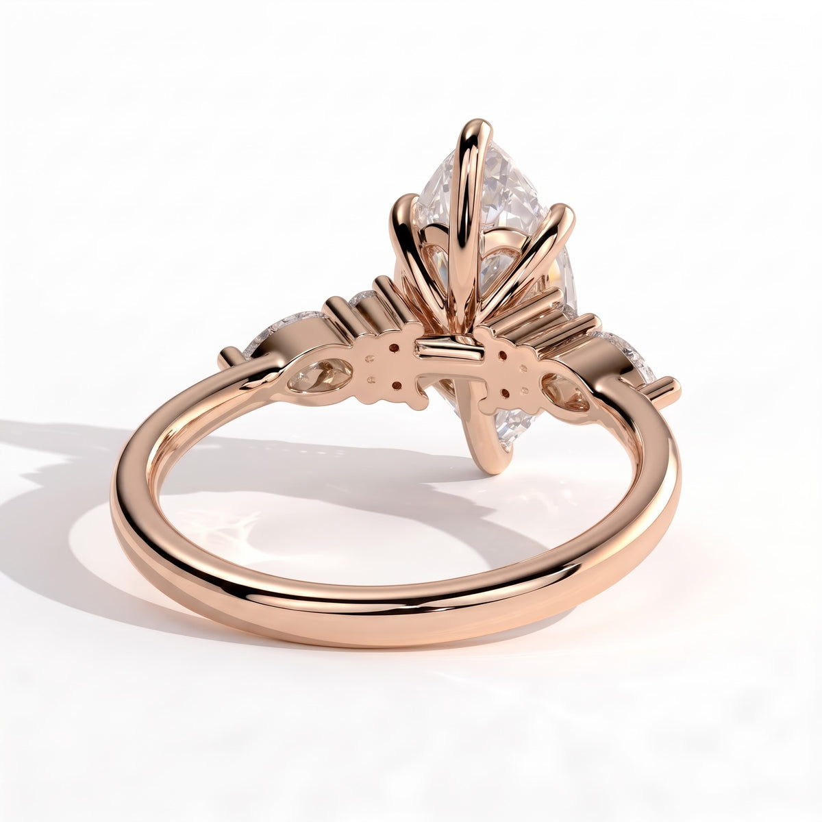Marquise lab-grown diamond halo engagement ring in 14K (585) rose gold, on white background 