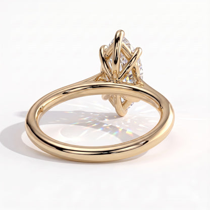 Marquise lab-grown diamond solitaire engagement ring in 18K (750) yellow gold, on white background 