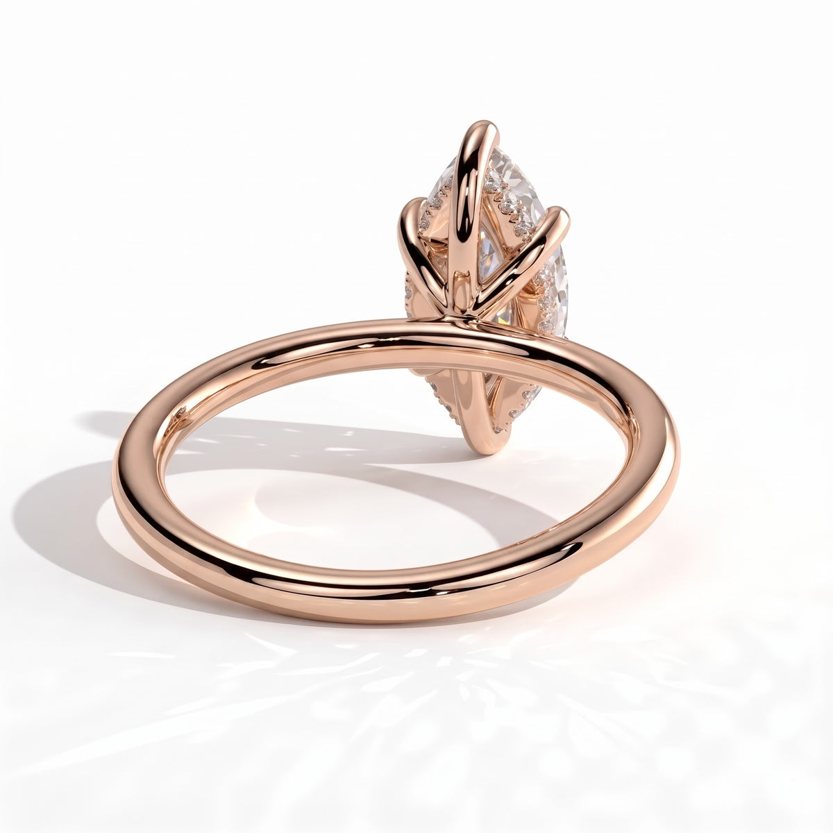Marquise lab-grown diamond solitaire engagement ring in 18K (750) rose gold, on white background 