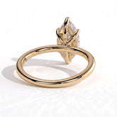 Marquise lab-grown diamond solitaire engagement ring in 18K (750) yellow gold, on white background 