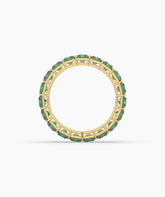 Amira emerald-cut green gemstone eternity ring in 750 yellow gold, top view 