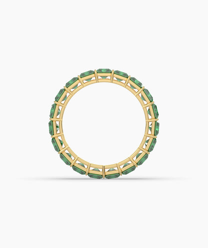Amira emerald-cut green gemstone eternity ring in 750 yellow gold, top view 