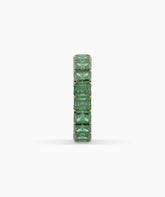 Amira emerald-cut green gemstone eternity ring in 750 yellow gold, side profile view 
