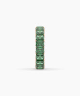 Amira emerald-cut green gemstone eternity ring in 750 rose gold, side profile view 