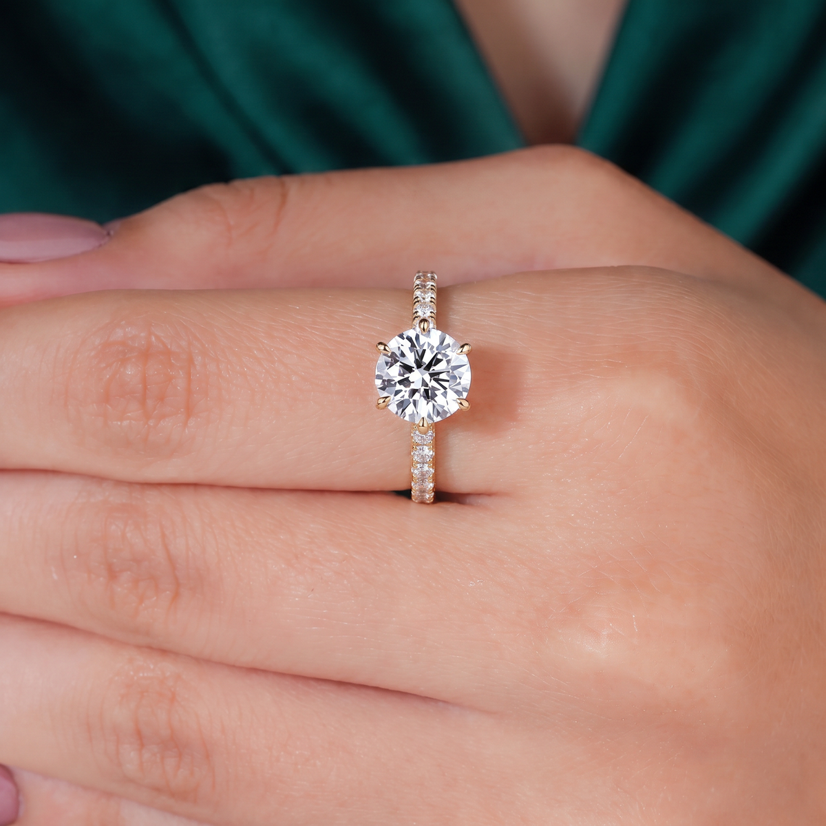 Round lab-grown diamond halo engagement ring in 950 platinum, worn on hand 