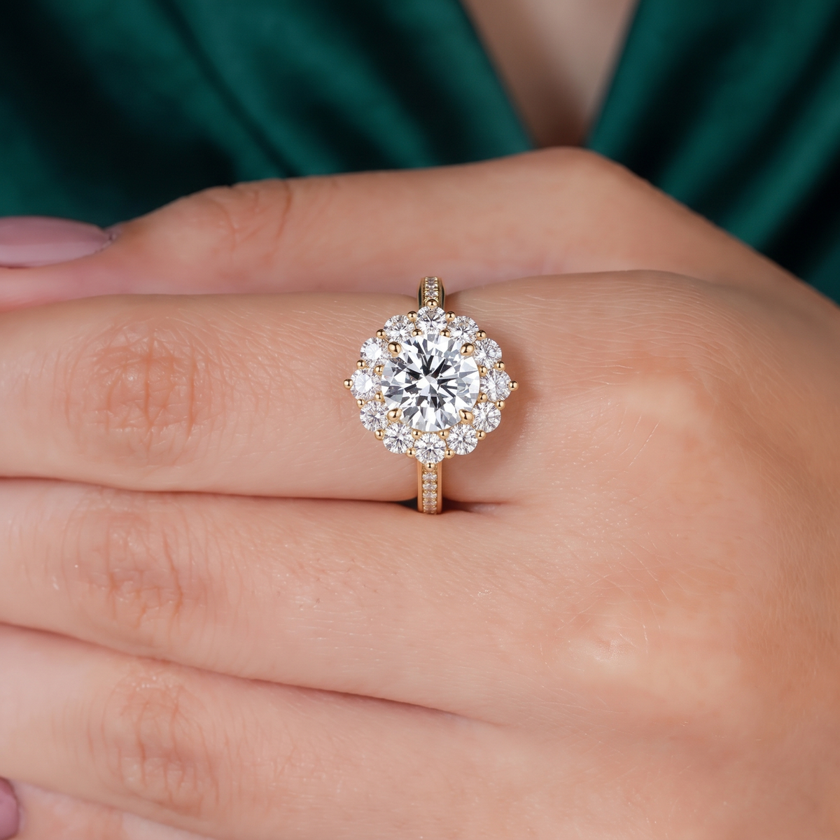 Round lab-grown diamond halo engagement ring in 14K (585) yellow gold, worn on hand 