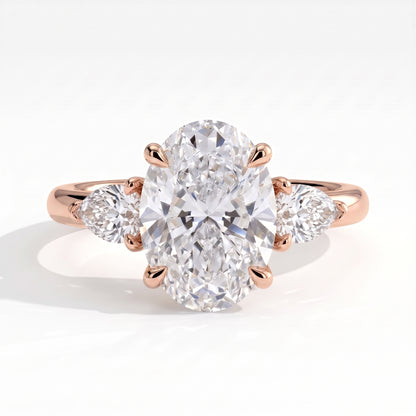 Oval lab-grown diamond three-stone engagement ring in 18K (750) rose gold, front view 