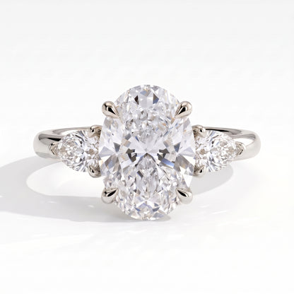 Oval lab-grown diamond three-stone engagement ring in 950 platinum, front view 