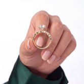 Oval lab-grown diamond bezel-set halo engagement ring in 18K (750) white gold, studio view 