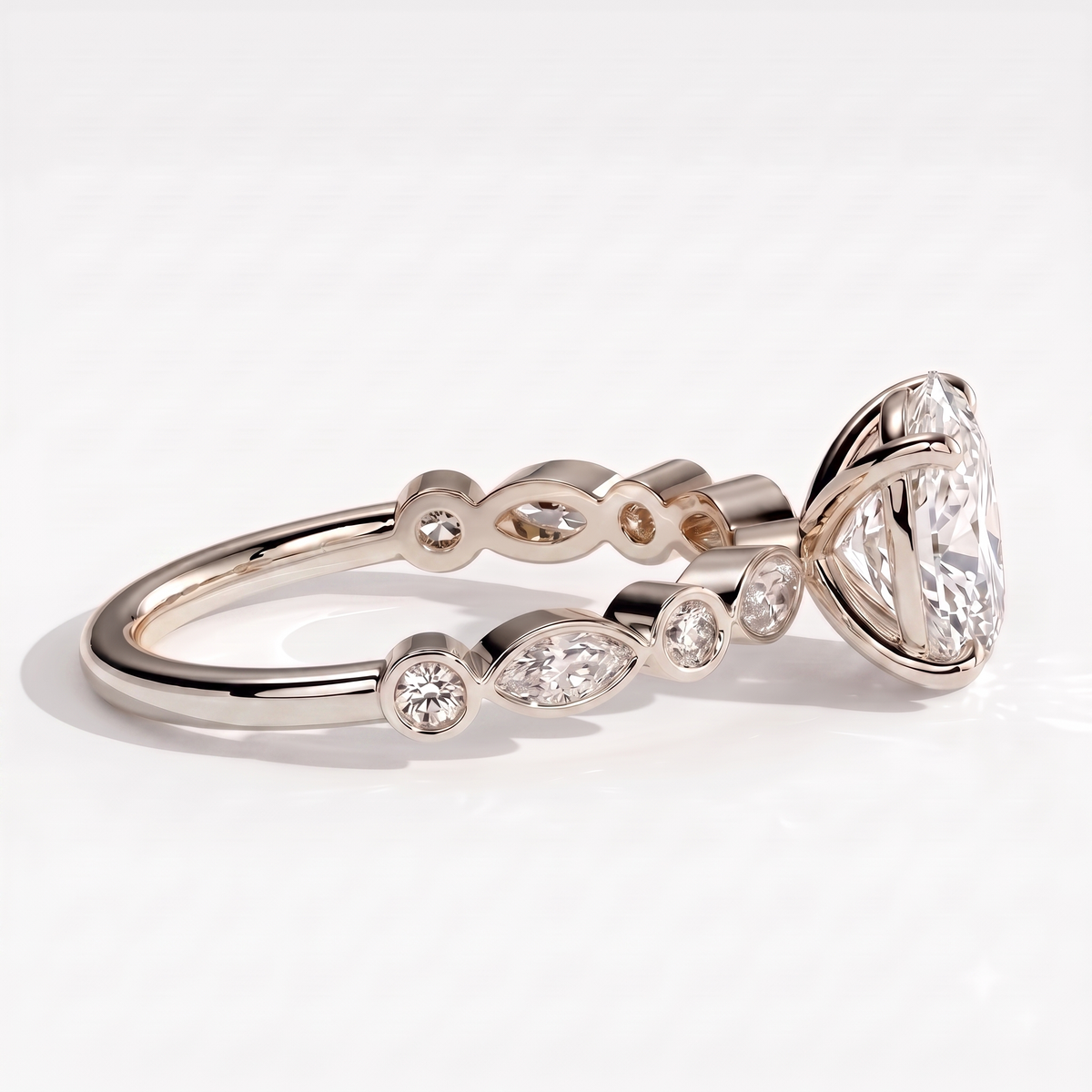 Oval lab-grown diamond bezel-set halo engagement ring in 950 platinum, on white background 