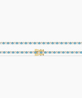 Isola Tennisarmband mit blauen und weißen runden Labordiamanten aus 585 Gelbgold, flach liegend, ganze Länge 