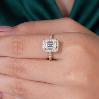 Emerald lab-grown diamond halo engagement ring in 18K (750) rose gold, worn on hand 