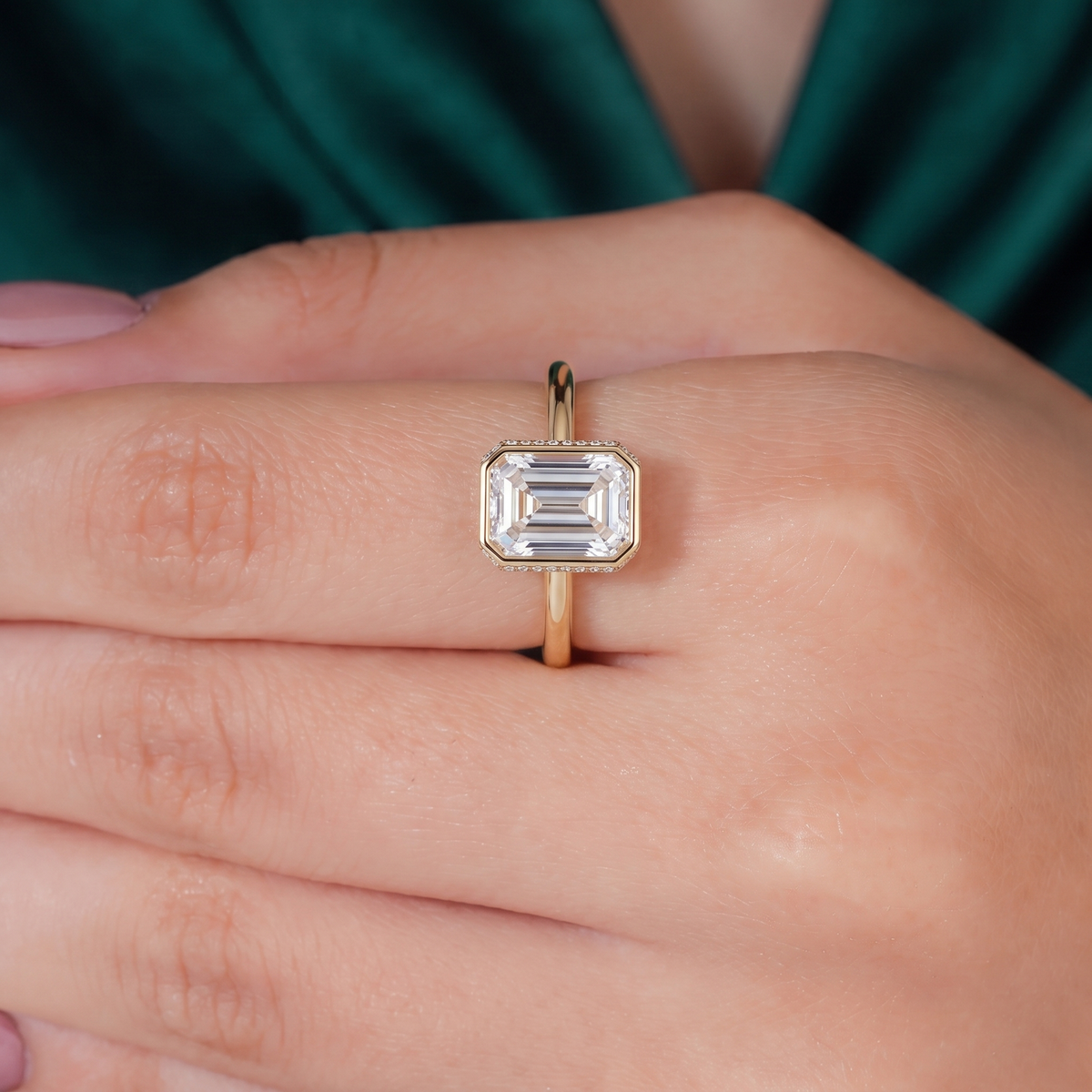 Emerald lab-grown diamond bezel-set halo engagement ring in 14K (585) white gold, three-quarter view 