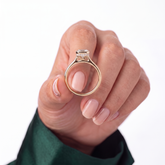 Emerald lab-grown diamond bezel-set halo engagement ring in 18K (750) rose gold, studio view 
