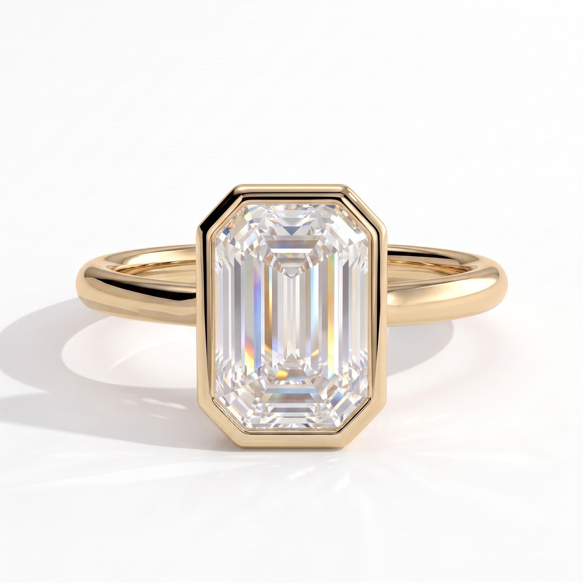Emerald lab-grown diamond bezel-set solitaire engagement ring in 14K (585) yellow gold, front view 
