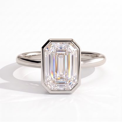 Emerald lab-grown diamond bezel-set solitaire engagement ring in 950 platinum, front view 