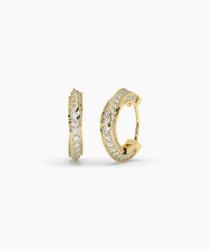 Gold hoop earrings with diamond accents on a white background. 