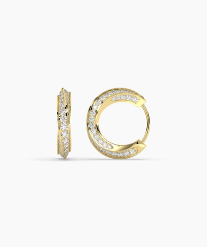Gold hoop earrings with embedded diamonds on a white background. 
