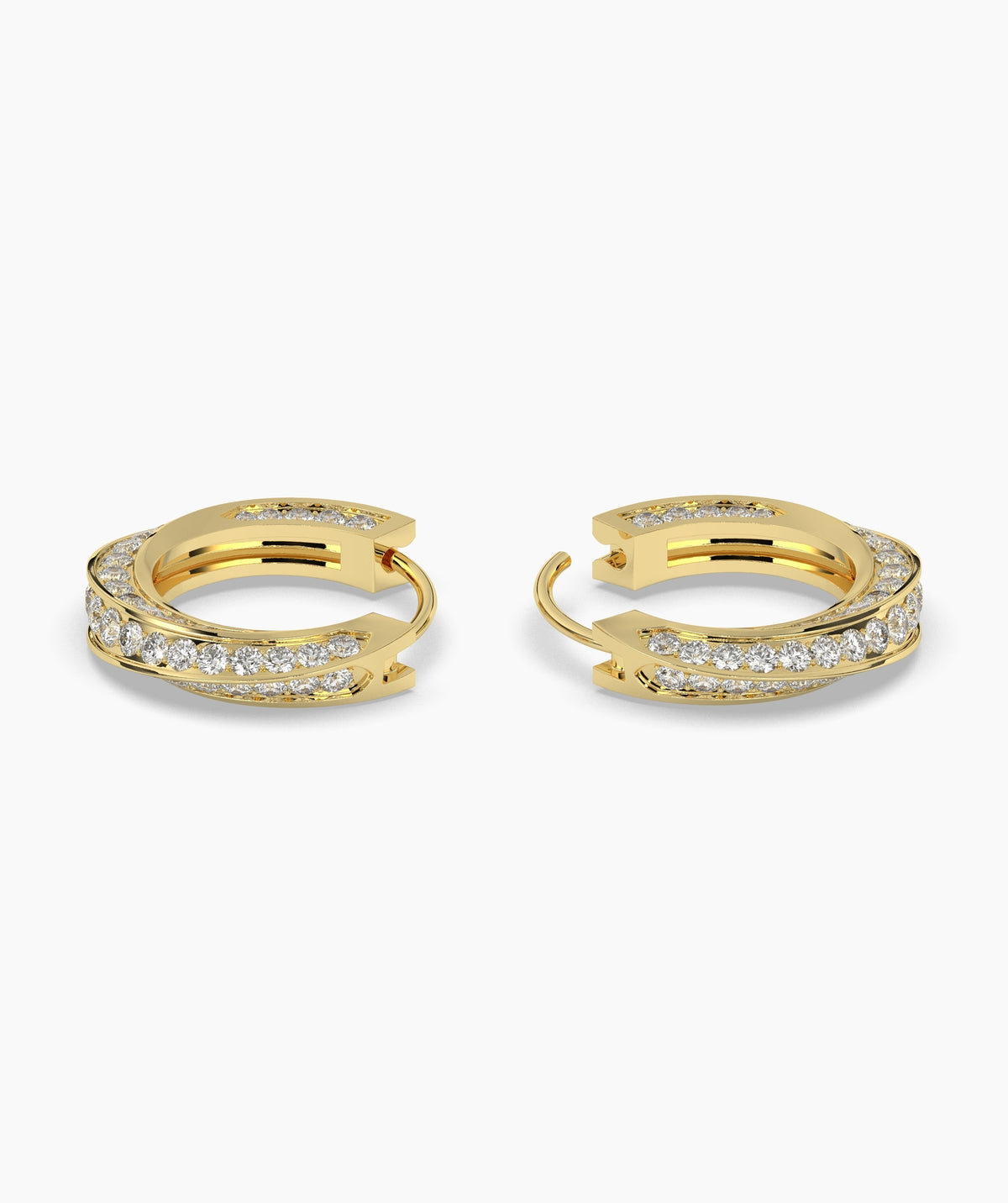 Gold hoop earrings with embedded diamonds on a white background. 