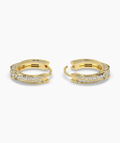 Gold hoop earrings with embedded diamonds on a white background. 