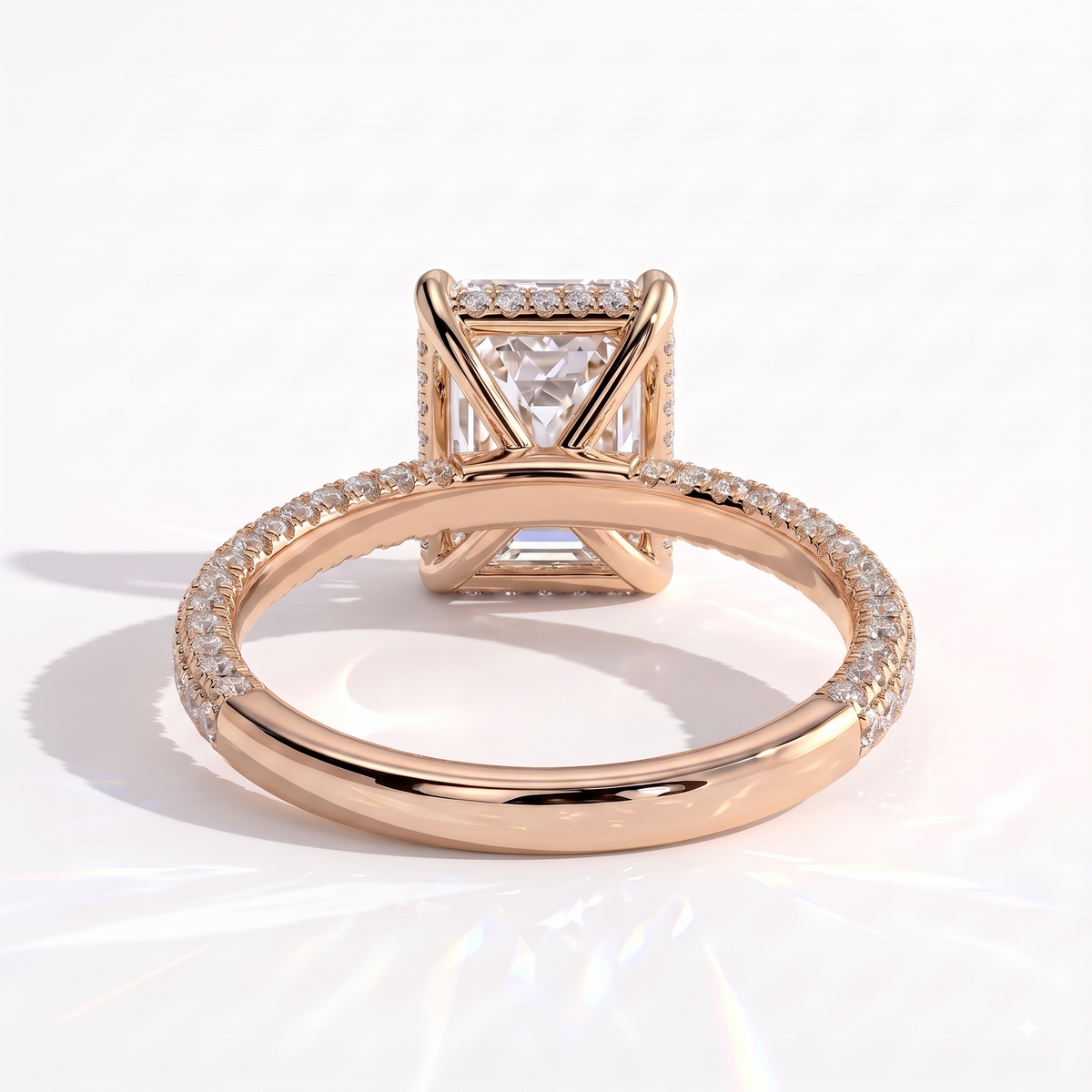 Radiant lab-grown diamond halo engagement ring in 14K (585) rose gold, on white background 
