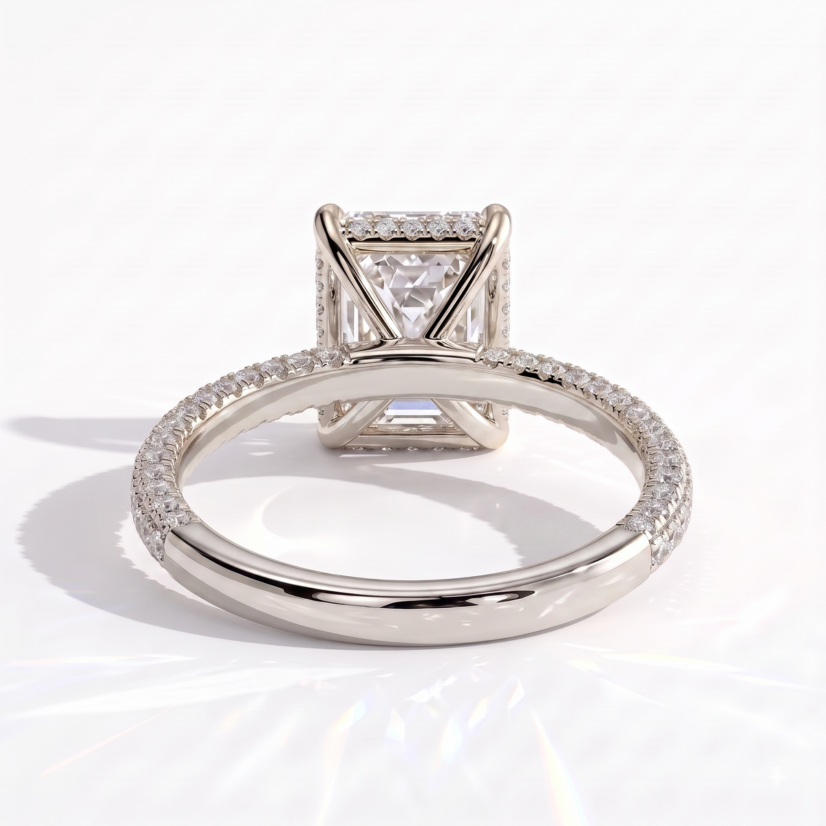 Radiant lab-grown diamond halo engagement ring in 950 platinum, on white background 