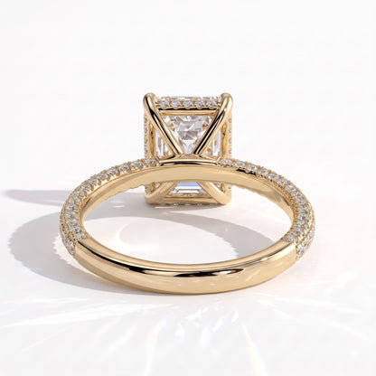 Radiant lab-grown diamond halo engagement ring in 18K (750) yellow gold, on white background 