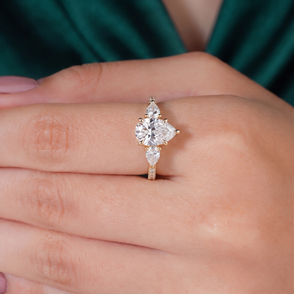 Pear lab-grown diamond three-stone engagement ring in 950 platinum, three-quarter view 