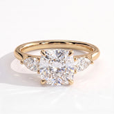 Cushion lab-grown diamond three-stone engagement ring in 18K (750) yellow gold, front view 