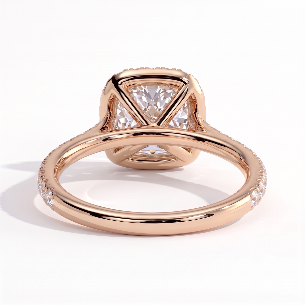 Cushion lab-grown diamond halo engagement ring in 18K (750) rose gold, on white background 