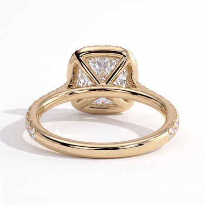 Cushion lab-grown diamond halo engagement ring in 14K (585) yellow gold, on white background 