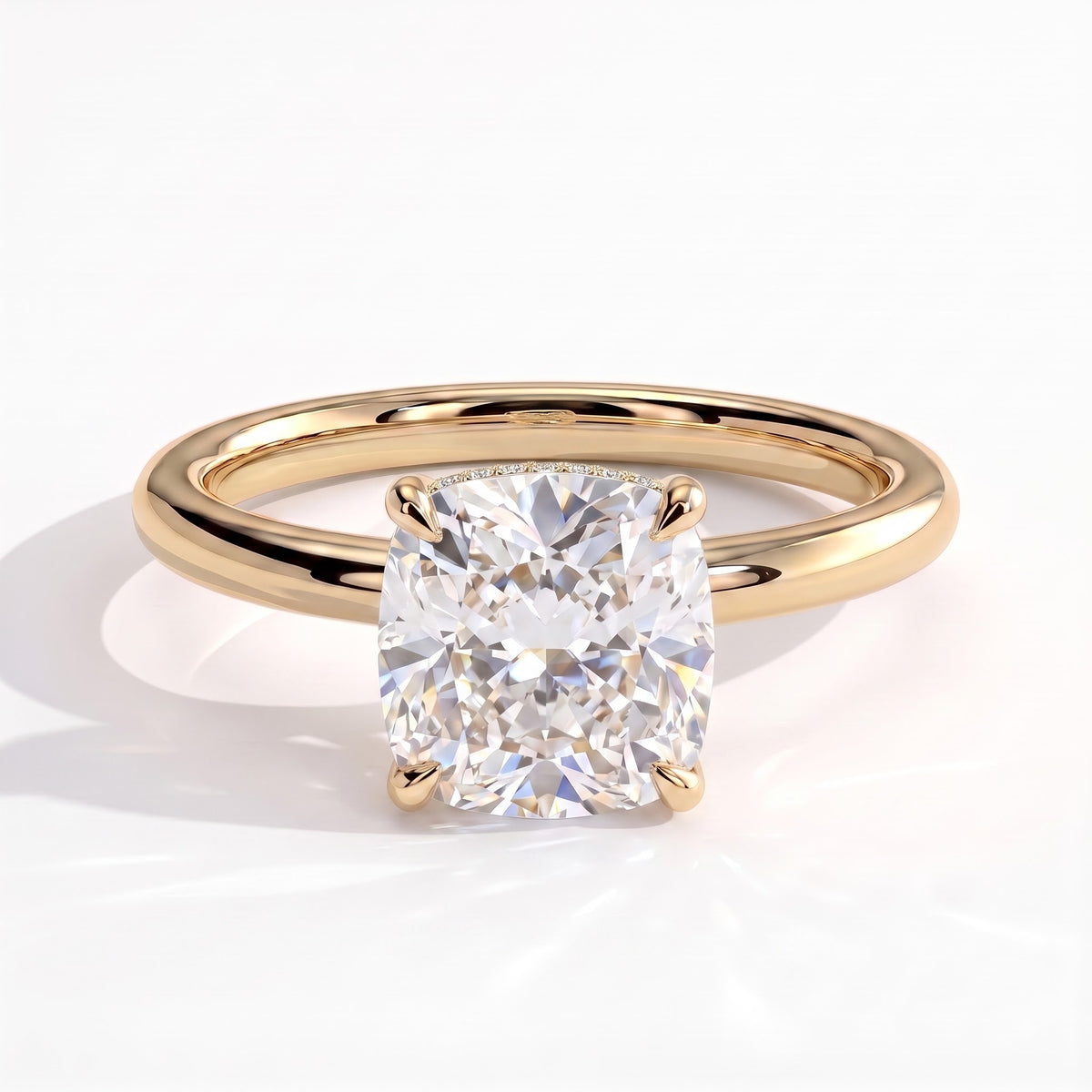 Cushion lab-grown diamond solitaire engagement ring in 14K (585) yellow gold, front view 