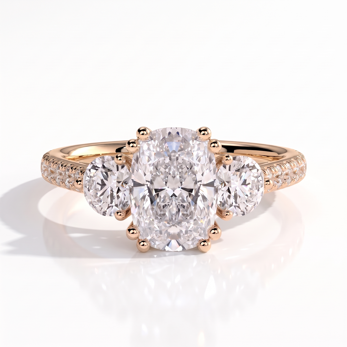 Elongated Cushion lab-grown diamond three-stone engagement ring in 14K (585) rose gold, front view 