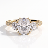 Elongated Cushion lab-grown diamond three-stone engagement ring in 14K (585) yellow gold, front view 