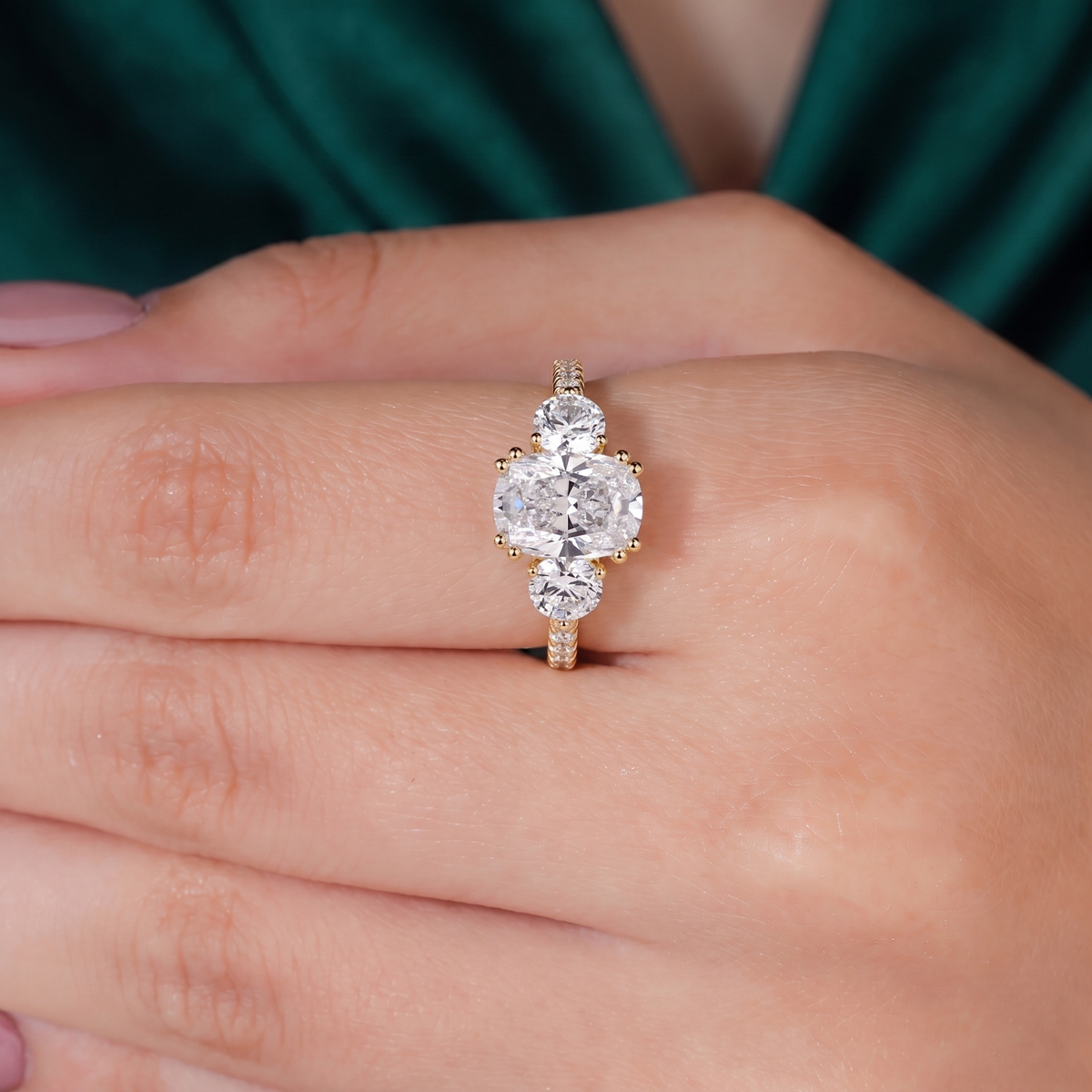 Elongated Cushion lab-grown diamond three-stone engagement ring in 14K (585) rose gold, three-quarter view 