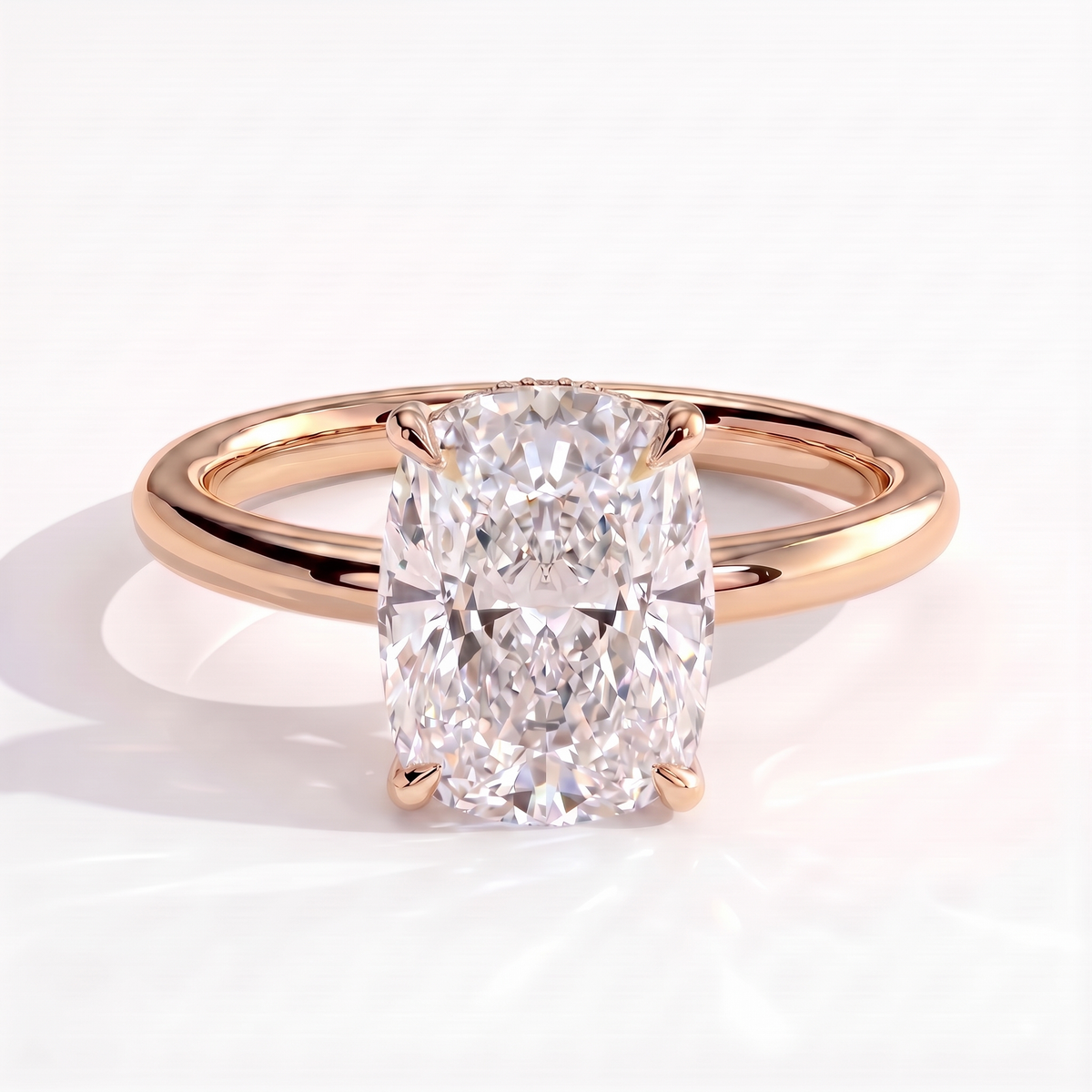 Elongated Cushion lab-grown diamond halo engagement ring in 18K (750) rose gold, front view 