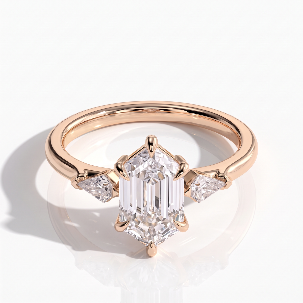 Elongated Hexagon lab-grown diamond three-stone engagement ring in 14K (585) rose gold, front view 