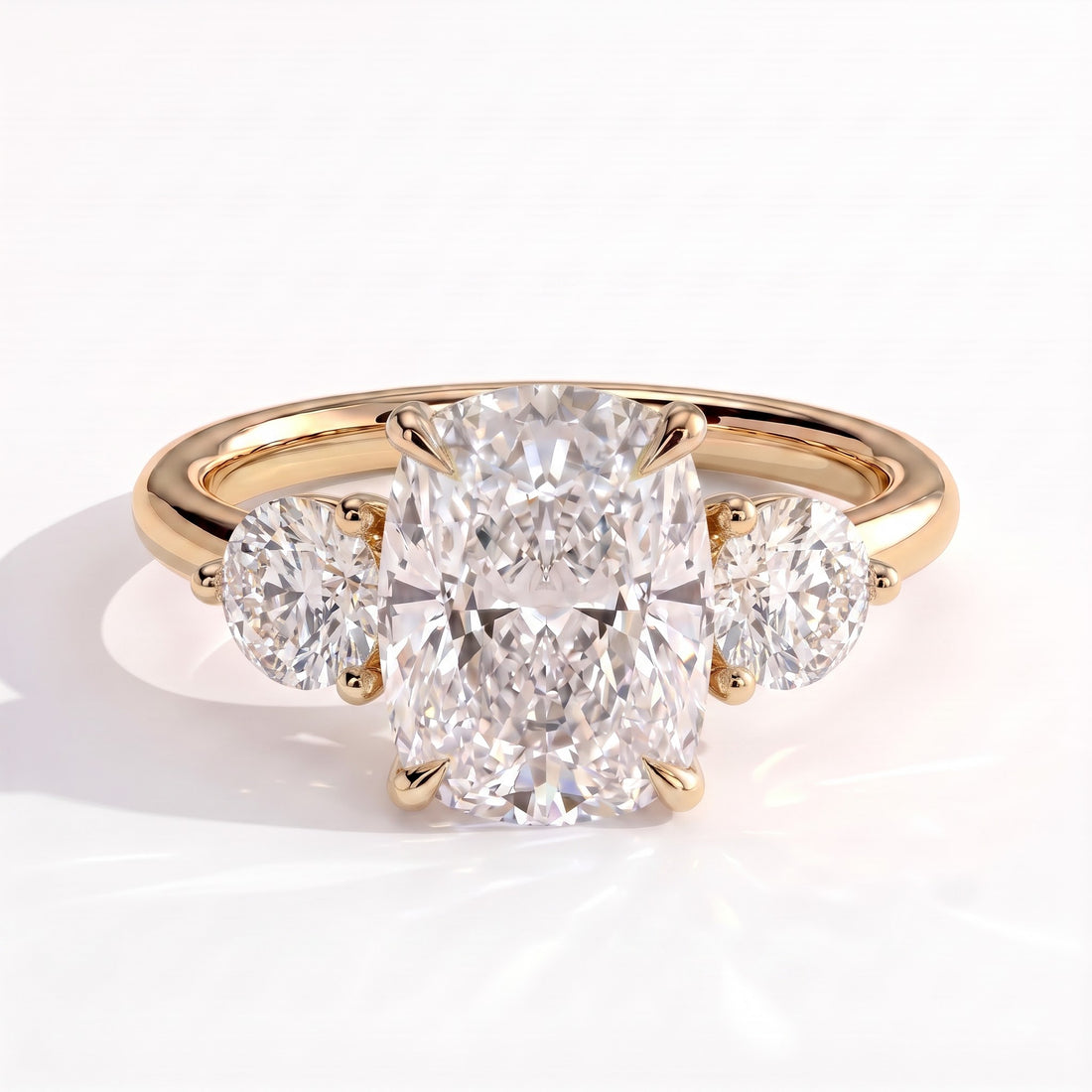 Elongated Cushion lab-grown diamond three-stone engagement ring in 14K (585) yellow gold, front view 