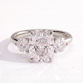 Elongated Cushion lab-grown diamond three-stone engagement ring in 950 platinum, front view 