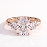 Elongated Cushion lab-grown diamond three-stone engagement ring in 18K (750) rose gold, front view 