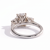 Elongated Cushion lab-grown diamond three-stone engagement ring in 18K (750) white gold, on white background 